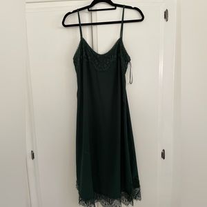 Brand new and unworn dark green laced dress. Size large